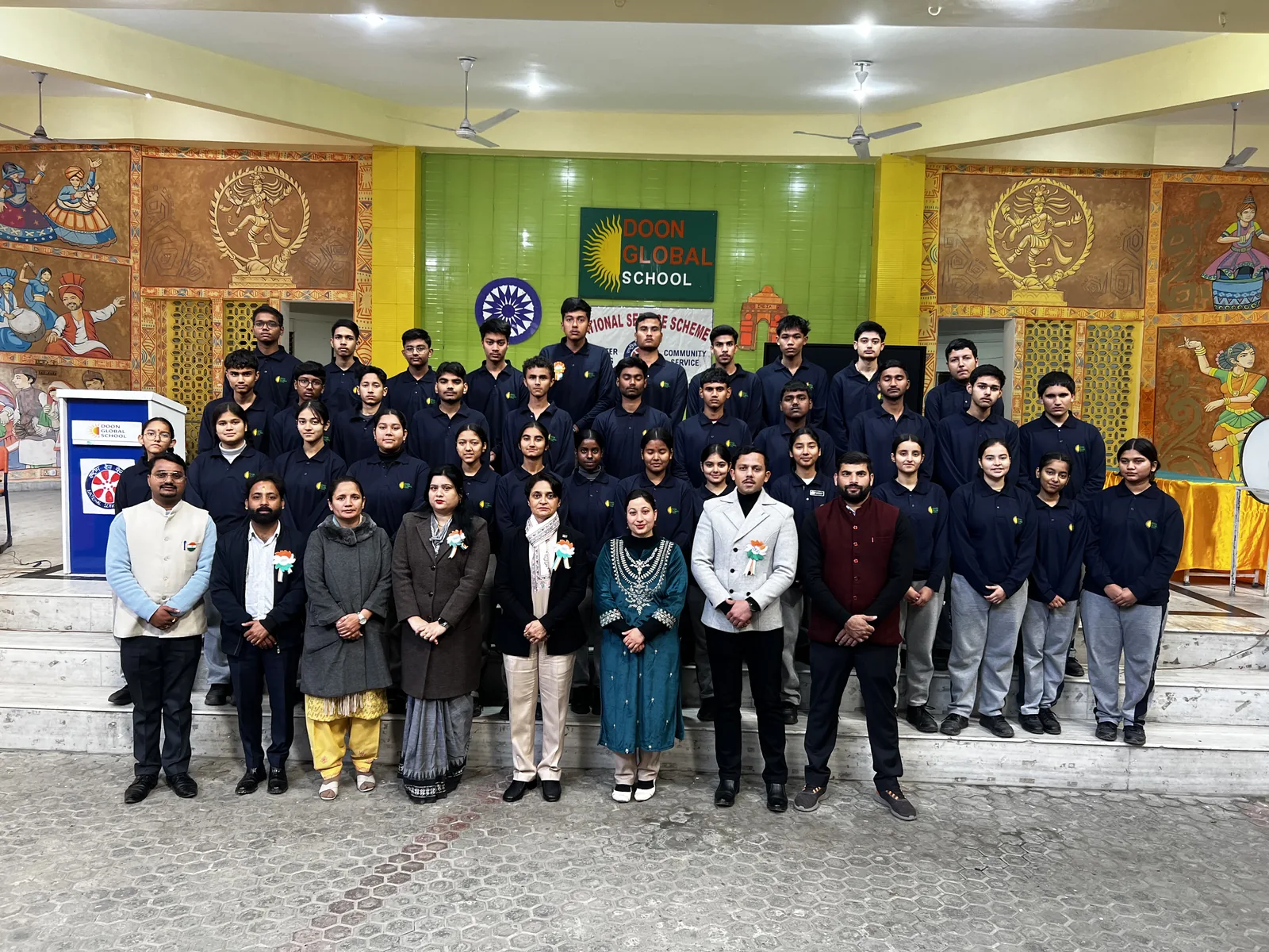 Senior students and teachers in a group photograph at the school entrance on Republic Day