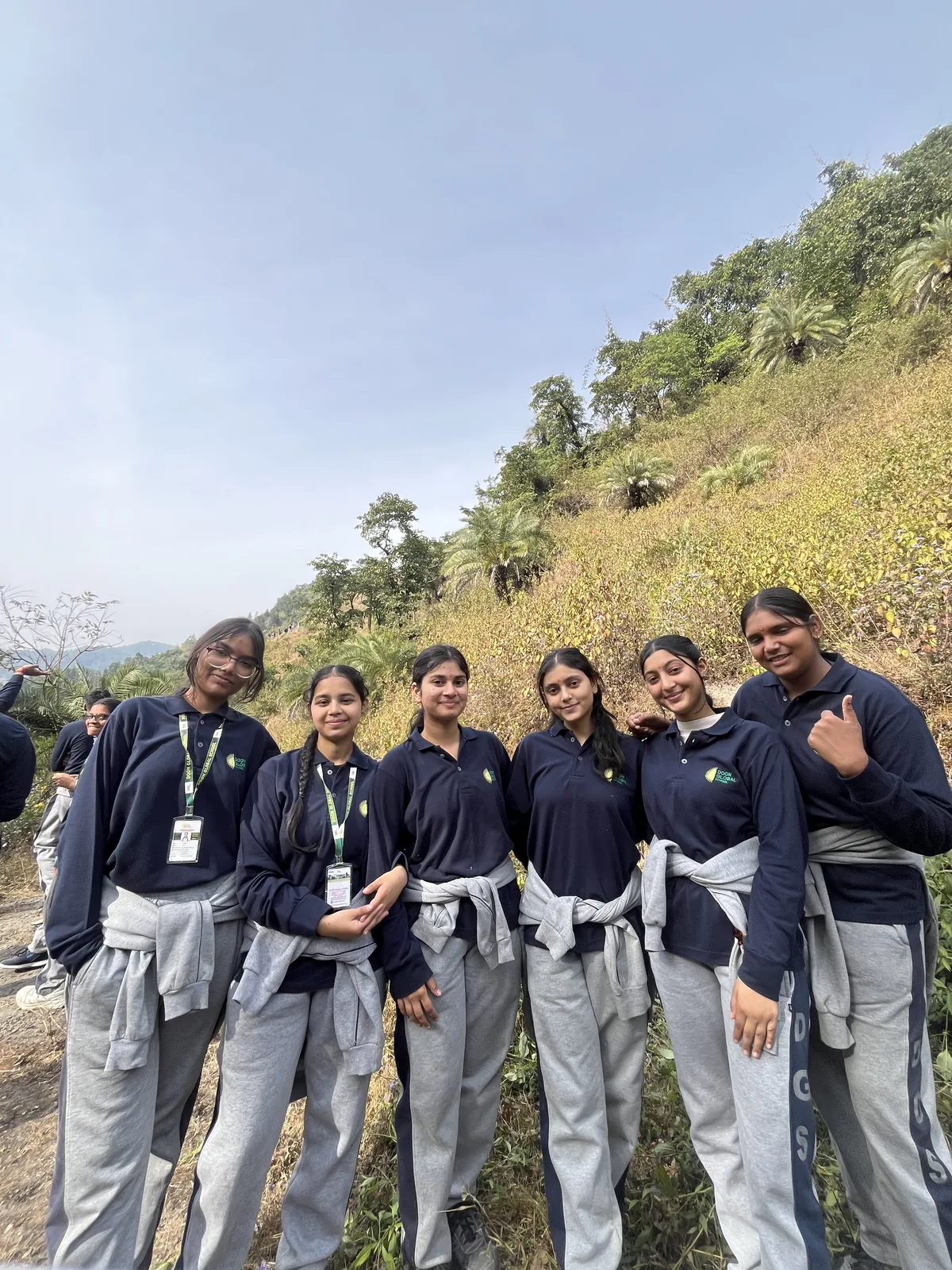 A group of students on a hillside during the school trek